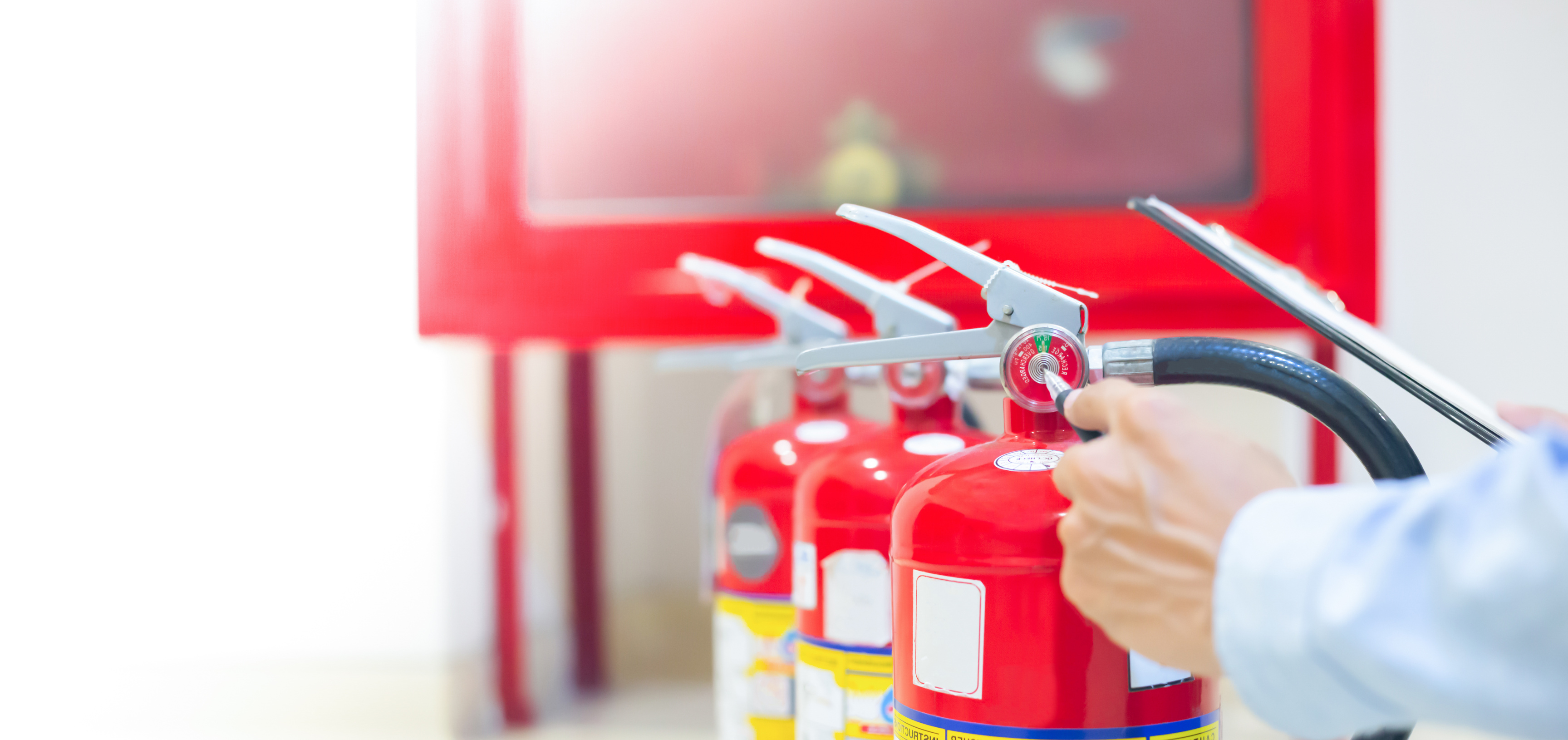 Expert engineers inspect fire extinguishers to be ready for use.